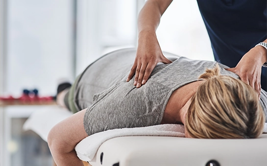 Chiropractic Merrick NY Woman Receiving Adjustment